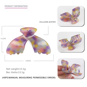 Marbled cellulose acetate shark hair claw clip in purple and orange tones, 6.8cm length