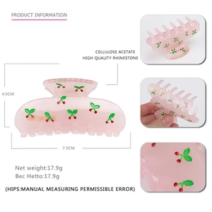 Pink translucent acetate cherry claw clip with rhinestones for elegant hairstyles