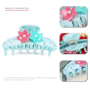 Striped marble blue acetate hair claw clip with pearl flower accents and rhinestones