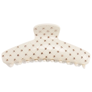 Detail view of large cream acetic shark hair clip with crystal lattice pattern