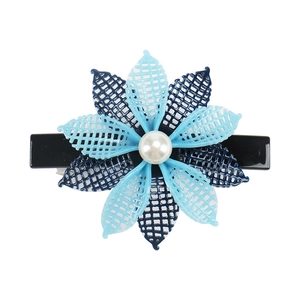 Detail of blue grid mesh flower hair clip with white pearl center and black duckbill base