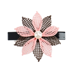 Detail of pink and brown grid petal flower hair clip with a white pearl center