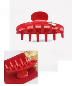 Detail of red acetate hair claw clip showing 8x4.5cm dimensions and pearl rabbit design