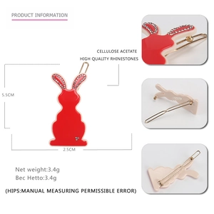 Detailed views of red rabbit hair clip made of cellulose acetate with rhinestones