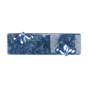 Detail of blue marble acetate hair clip featuring elegant rhinestone floral embellishments