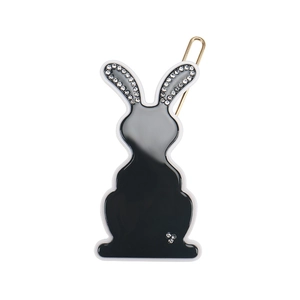 Detail of a black rabbit hair clip with rhinestones and a gold metal U-shaped clasp
