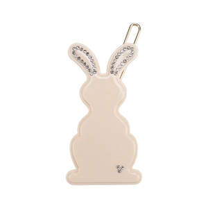 Close-up of rabbit hair clip with beige resin finish and sparkling rhinestone inlay