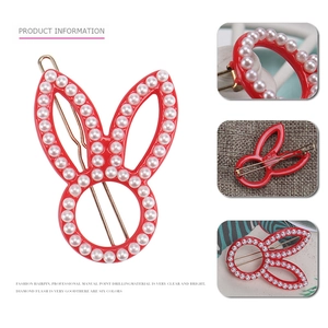 Cute red acetate rabbit hair clip with white pearl edges and golden metal clasp for women