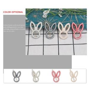 Cute rabbit ear hair clip with white pearls available in six vibrant assorted colors