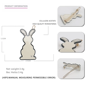 Off-white rabbit hair clip with rhinestones and dimensions of 5.5CM by 2.5CM