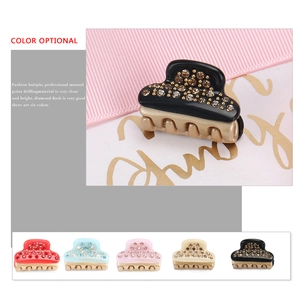 Mini acetate hair claw clip with crystals and golden metal base in five elegant colors