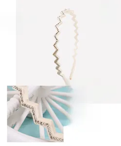 Detail of wavy acetate headband featuring clear crystals and premium material specs