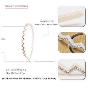 Wavy acetate headband with sparkling rhinestones in a creamy white elegant finish
