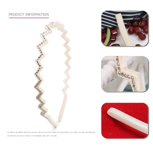 Elegant ivory wavy headband with rhinestone details and acetate finish for women