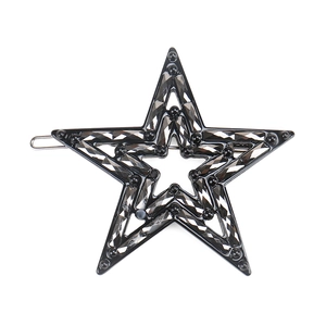 Detail of star-shaped hair clip with black faceted crystals and metal snap clip mechanism