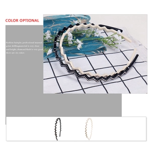Sparkling wave-shaped headband with hand-set rhinestones in black and creamy white