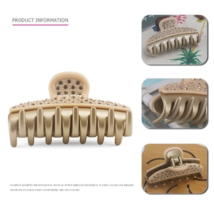 Detailed view of luxury large hair claw clip with champagne crystals and golden finish