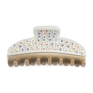 Macro detail of large luxury hair claw clip with colorful AB rhinestones and gold teeth