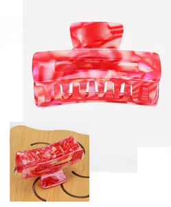 Detail of red marble acetate square hair claw clip with dimensions 7.5x4cm
