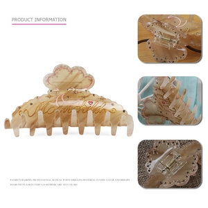 Large cloud shark hair clip with Moonchild lettering and sparkling amber starry texture