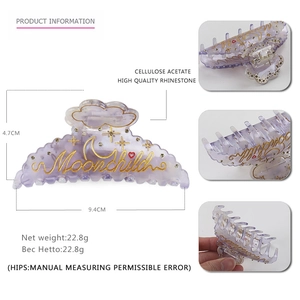 Translucent purple acetate Moonchild hair claw clip with celestial gold pattern and crystals