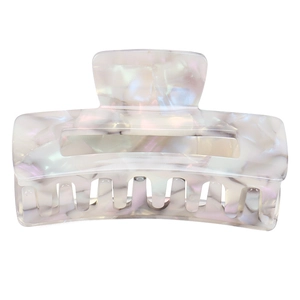Detail of square acetate claw clip with purple marble pattern and pearlescent finish