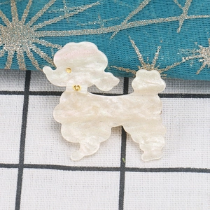 Cute teddy dog acrylic hair clip with pearlescent white finish and gold accents