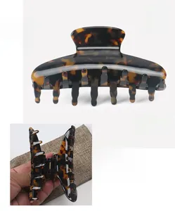 Detail view of large tortoise shell hair claw made of premium cellulose acetate material