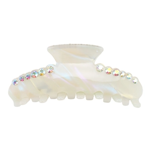 Close-up of pearl white acetate hair claw clip with colorful rhinestones on top
