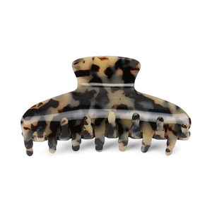 Macro shot of French vintage tortoiseshell hair claw clip with brown leopard pattern detail