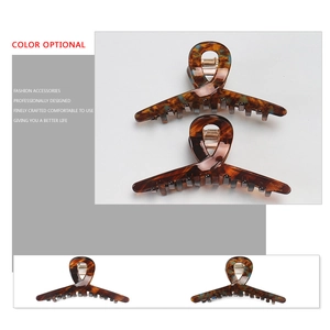 Tortoiseshell acetate hair claws in dark and light brown patterns for elegant hairstyles