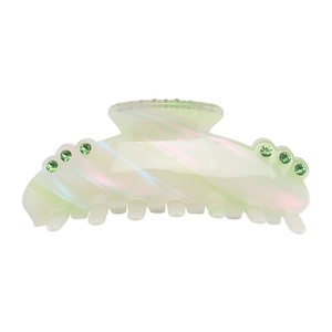 Detail view of large acetate hair claw clip with colorful iridescent green finish and rhinestones