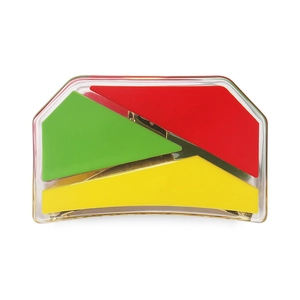 Close-up of geometric acetate hair claw with vibrant red, green, and yellow color blocks