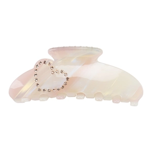 Summer acetate hair claw with pearlescent pink marble pattern and rhinestone heart