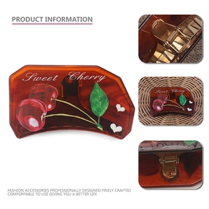 Brown tortoiseshell hair claw with sweet cherry pattern and strong gold metal spring