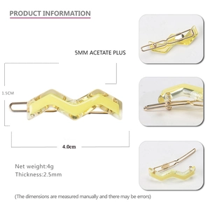 Macro view showing dimensions and texture of the yellow acetate zigzag hair clip