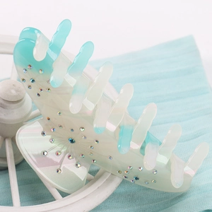Large acetate hair claw clip with light blue gradient finish and rhinestone stars