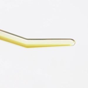 Macro shot of translucent light yellow acetate hair clip tips with premium glossy finish