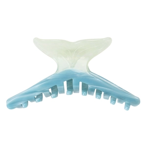 Detail of blue and white gradient whale tail hair claw clip with acetate marble texture