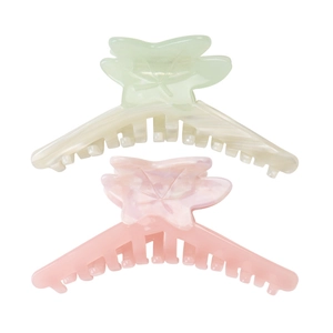 Close-up of pink and green maple leaf hair claw clips with detailed resin textures