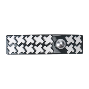 Detailed view of rectangular houndstooth hair clip with a silver metallic ball accent