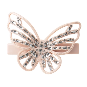 Detail view of pink butterfly hair clip with sparkling rhinestones and hollow wing pattern
