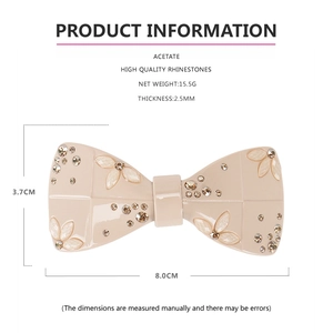 Detail view of acetate bow hair clip with rhinestones, size 8.0x3.7cm and 15.5g weight