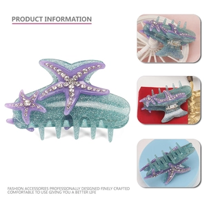 Starfish hair claw clip with blue glitter finish and rhinestone embellishments