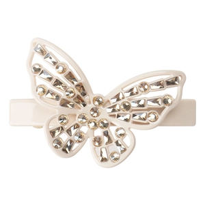 Close-up of cream butterfly hair clip with champagne rhinestones and resin detail