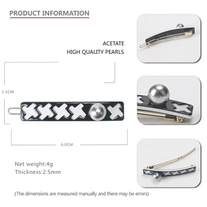 Houndstooth acetate hair clip with silver-gray pearl accent and spring metal back