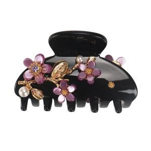 Elegant floral hair claw clip with purple resin flowers pearls and golden metal leaves