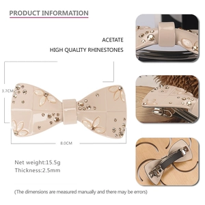 Elegant acetate bow hair clip with floral embossing and champagne rhinestones, 8cm size