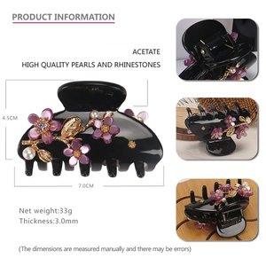 Acetate flower hair claw clip with purple petals, pearls, and rhinestones for women