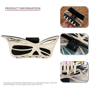 Large acetate butterfly hair claw clip with cream and black hollow design for women